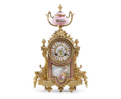 A FRENCH ORMOLU AND PORCELAIN MANTEL CLOCK LATE 19TH CENTURY the brass eight day drum movement striking on a bell, the back p