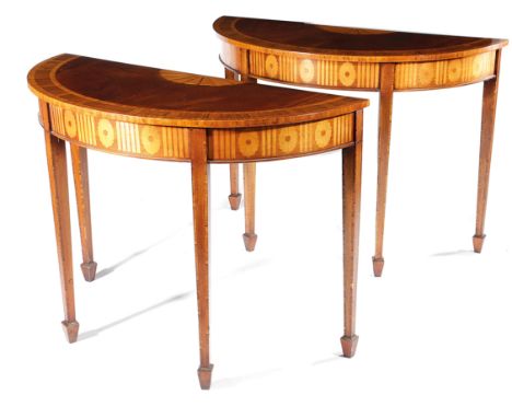 λ A PAIR OF MAHOGANY DEMI-LUNE CONSOLE TABLES IN GEORGE III STYLE LATE 20TH CENTURY inlaid with satinwood fan paterae and wit