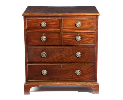 A GEORGE III MAHOGANY COMMODE CHEST OR NIGHT TABLE AFTER A  DESIGN BY GEORGE HEPPLEWHITE, C.1790 the hinged top with a moulde