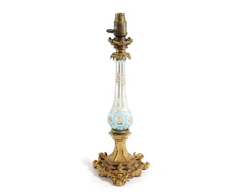 A VICTORIAN BOHEMIAN GLASS AND ORMOLU TABLE LAMP MID-19TH CENTURY the blue glass overlay stem decorated with flowers and scro