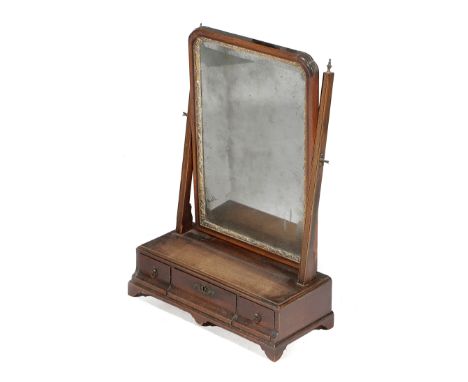 A GEORGE II MAHOGANY DRESSING TABLE MIRROR C.1740 with a bevelled plate and a giltwood slip, the box base with a caddy moulde