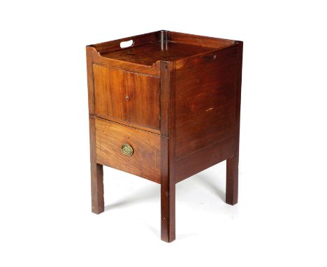 A GEORGE III MAHOGANY TRAY-TOP BEDSIDE COMMODE C.1800 the galleried top pierced with two handgrips, above a cupboard, the pul