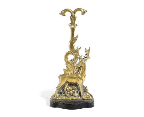 A BRASS STAG DOORSTOP FIRST HALF 20TH CENTURY with a lappet leaf handle and a weighted base 40.4cm high