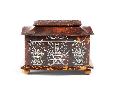 λ A LATE REGENCY TORTOISESHELL AND MOTHER OF PEARL TEA CADDY EARLY 19TH CENTURY of pagoda shape, with pewter stringing and in