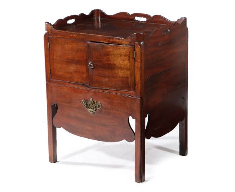 A GEORGE III MAHOGANY TRAY-TOP BEDSIDE COMMODE LATE 18TH CENTURY the shaped gallery pierced with three handgrips, above a pai