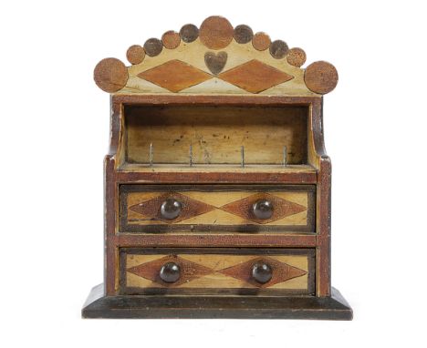 A FOLK ART PAINTED PINE BOBBIN STAND LATE 19TH / EARLY 20TH CENTURY decorated with rondels, lozenges and a loveheart, with fo