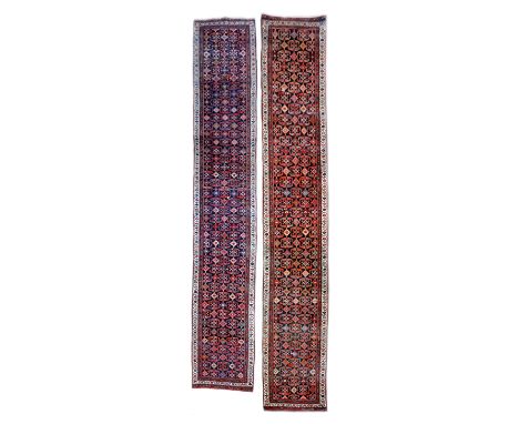 A NEAR PAIR OF RUNNERS NORTH WEST PERSIA, FIRST HALF 20TH CENTURY one later cut into two sections (3) 509cm long 88cm wide, 2