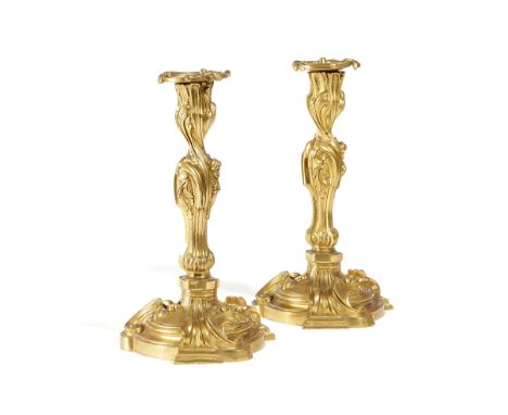 A PAIR OF FRENCH ORMOLU CANDLESTICKS IN ROCOCO STYLE IN THE MANNER OF MEISSONNIER, MID-19TH CENTURY the undersides stamped wi