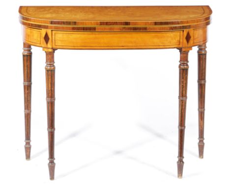 λ A REGENCY SATINWOOD CARD TABLE EARLY 19TH CENTURY inlaid with stringing and with rosewood banding, the fold-over top on twi