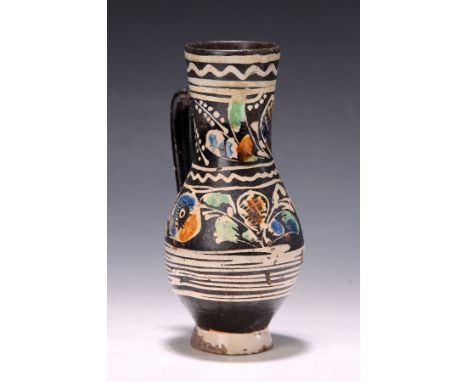 Krug, Ungarn, um 1820-40,  Fayence, schwarzgrundig, bunt bemalt mit stil. Blumen, H. ca. 23cmPitcher, Hungary, c. 1820-40, fa