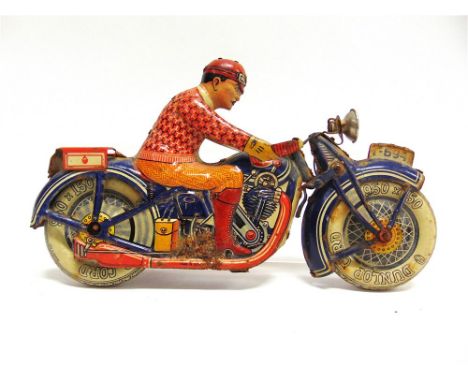 A TIPP & CO. TINPLATE MOTORCYCLE blue, registration 'T-694', with printed 'Dunlop Cord' tyres, the rider with a helmet, sweat