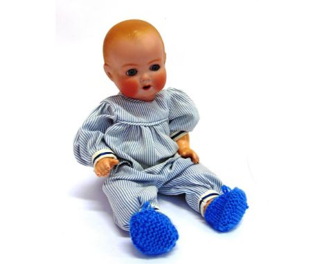 AN ARMAND MARSEILLE BISQUE SOCKET-HEAD DOLL with moulded and spray-painted hair, sleeping blue glass eyes,and an open mouth w