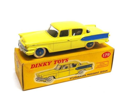 A DINKY NO.179, STUDEBAKER PRESIDENT pale yellow with mid blue rear side flashes, mid blue ridged hubs, white M tyres, excell