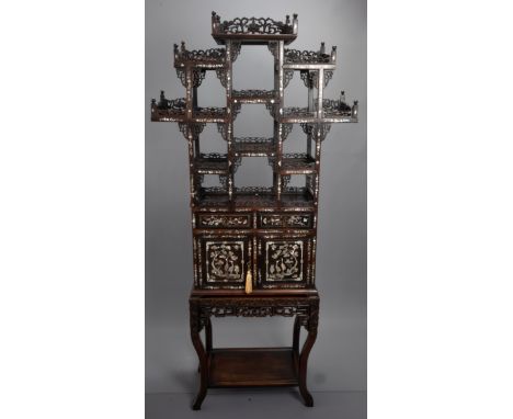 A TALL CHINESE HARDWOOD INLAID DECORATED DISPLAY CABINET, EARLY 20TH CENTURY. In two sections comprising the upper section wi