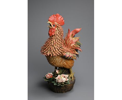 A LARGE CHINESE POLYCHROME MODEL OF A ROOSTER, 20TH CENTURY. Finely modelled rooster crowing, standing on rockwork with peony