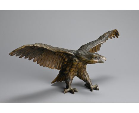 A JAPANESE CAST BRONZE MODEL OF AN EAGLE, 19/20TH CENTURY. Well cast, standing with its wings spread. Possibly Meiji period. 
