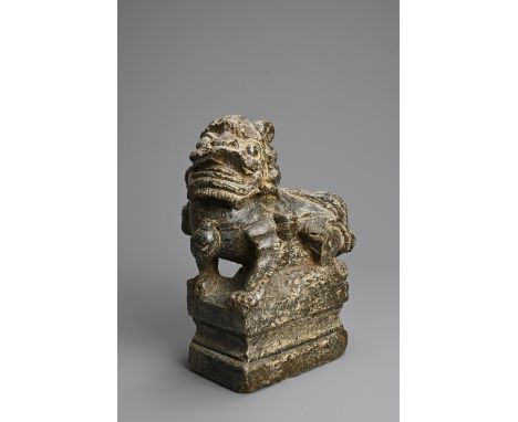 A CHINESE CARVED GREY STONE MODEL OF A GUARDIAN LION, MING DYNASTY. The lion seated on a raised pedestal. Probably from Shanx