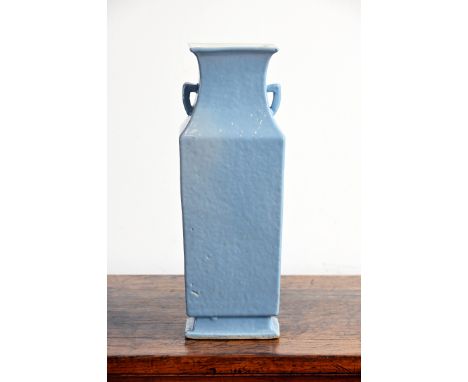 A CHINESE CLAIRE DE LUNE GLAZED PORCELAIN VASE, 19TH CENTURY. Of square baluster form on a splayed foot with lug handles cove