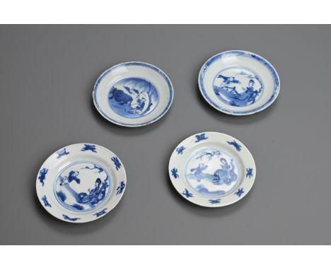 A GROUP OF FOUR CHINESE BLUE AND WHITE PORCELAIN SAUCERS, EARLY 18TH CENTURY. To include a pair depicting a lady and child pl