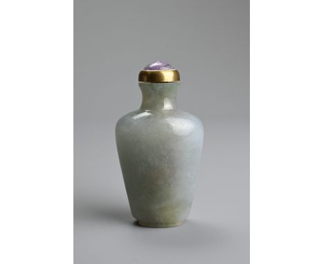 A CHINESE CARVED JADE SNUFF BOTTLE, QING DYNASTY. The jade green with patches of pale purple, of flattened baluster form with