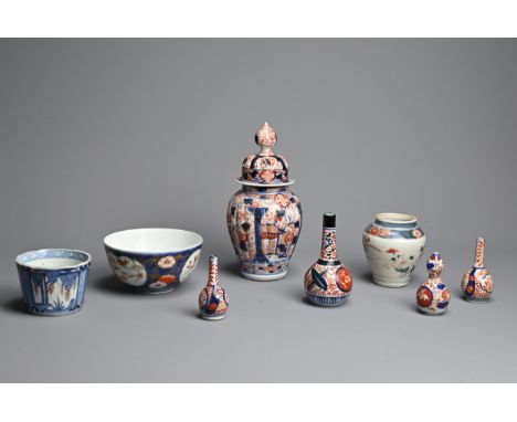 A GROUP OF JAPANESE IMARI PORCELAIN, 18-19TH CENTURY. Comprising: a fluted oviform vase and domed cover, painted with pavilio