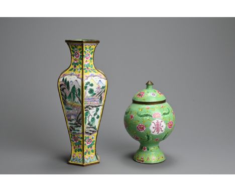 A CHINESE CLOISONNE ENAMEL YELLOW-GROUND BALUSTER VASE AND A GREEN GROUND OVIFORM VASE AND COVER, EARLY 20TH CENTURY. The fir