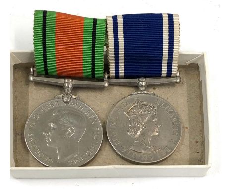 Boxed ER2 police exemplary service medal and defence medal, medal names constable John Law 