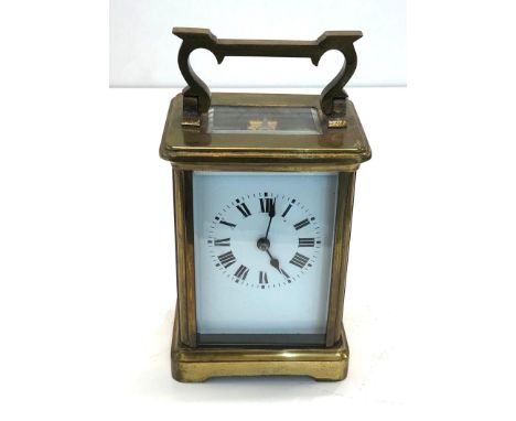 Vintage french brass carriage clock clock is ticking but no warranty given 