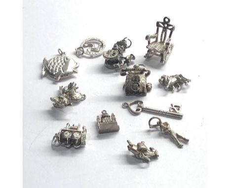 Selection of 12 vintage silver charm bracelet charms 