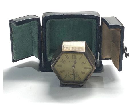 Vintage cased silver 8 day travel clock in fitted leather carrying case import silver hallmarks to base clock winds and ticks