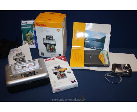 A Kodak easy share Camera, cartridge, photo paper, etc