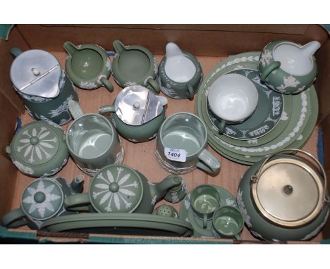 A quantity of green Wedgwood jasper ware including tankards, biscuit barrel, cups and saucers, coffee pot, teapot, water jugs