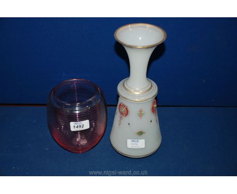 A Victorian cranberry ribbed Vase and a Bohemian milk glass Vase with enamel decoration