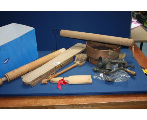 A quantity of kitchenalia including flour sieve circa 1900, cast iron mincer, rolling pin, steam ironing roll for tailoring, 