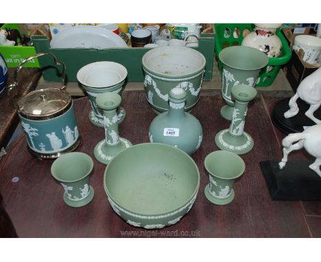 A quantity of green Wedgwood jasper ware including vases, candlesticks, decanter, jardiniere, biscuit barrel, fruit dish, etc
