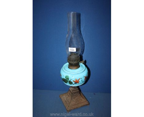 A Victorian Oil Lamp with turquoise glass reservoir on caste base