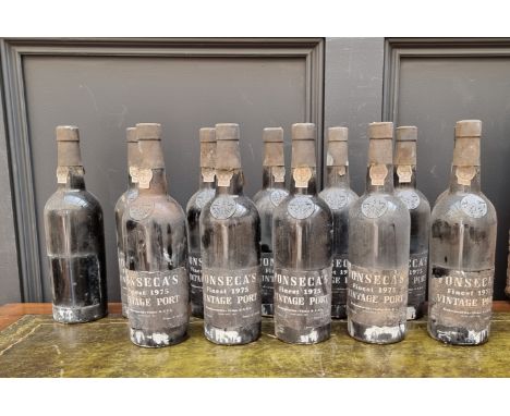 Twelve 75cl bottles of Fonseca's 1975 vintage port, in vintage R White's pine crate, (one lacking label). (12)