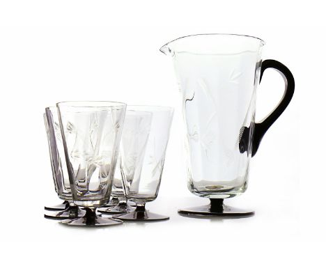 ART DECO GLASS JUG AND SIX HIGH BALL GLASSES the jug of tapering faceted form cut with floral motifs, black glass handle, eac