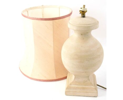 A classical design table lamp in polished stone, 37cm H, with shade.