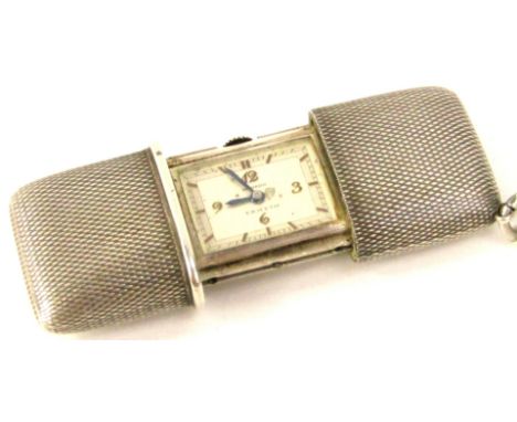 A 1920s silver Movado Ermeto ladies purse watch, having cream dial with Arabic gilt applied numbers, with minute track, inter