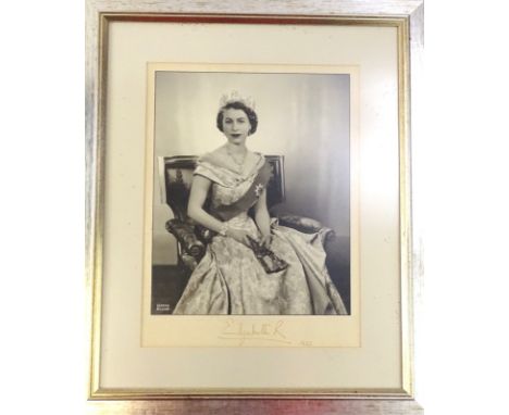 After Dorothy Wilding, Photographic portrait of Queen Elizabeth II, signed Elizabeth R, 1953, 34cm x 25cm.