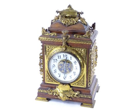 A late 19thC/early 20thC oak and brass bracket clock with German eight day movement striking a gong, 43cm H.