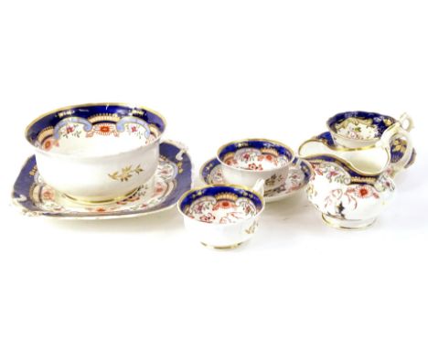 A 19thC English porcelain part tea service, blue ground with Japanesque reserves (AF).