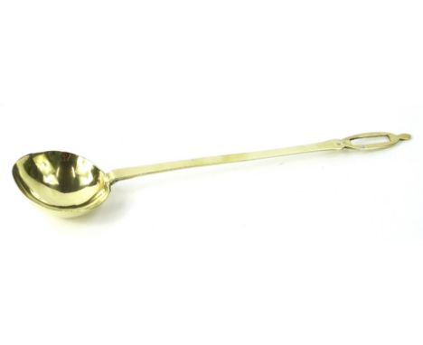 A heavy brass ladle, the handle stamped WM, 50cm L.