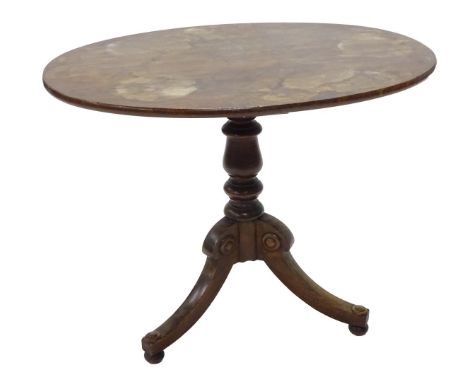 An oak and mahogany occasional table, with oval top on a turned column and tripod base, 19thC but adapted, 64cm W.