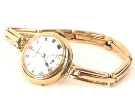 A Thos Russell and Son 9ct gold wristwatch, with circular white enamel dial, blue hands, seconds dial, (AF), on expanding 9ct