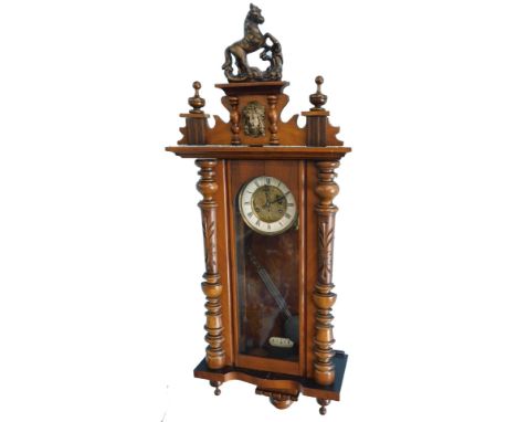 A late 19th/early 20thC Vienna wall clock, the enamel type dial with Roman numerals decorated to the centre with Art Nouveau 
