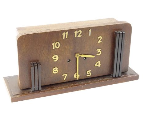 A mid 20thC Art Deco mantel clock, with Arabic numerals on a stepped rectangular base, 48cm W, with two keys.