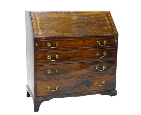 A George III mahogany ebony strung bureau, the fall enclosing a fitted interior of four graduated drawers with later brass dr
