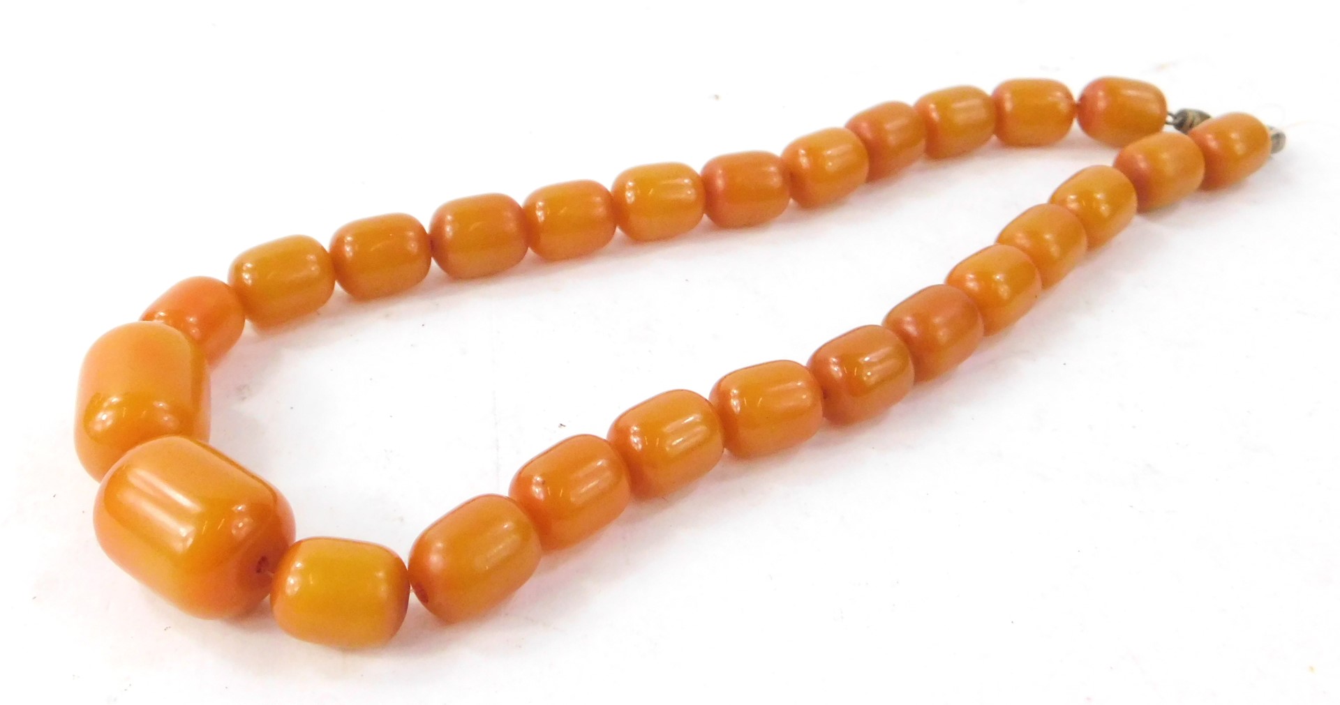 A set of Bakelite style beads, each of rectangular cylindrical form.